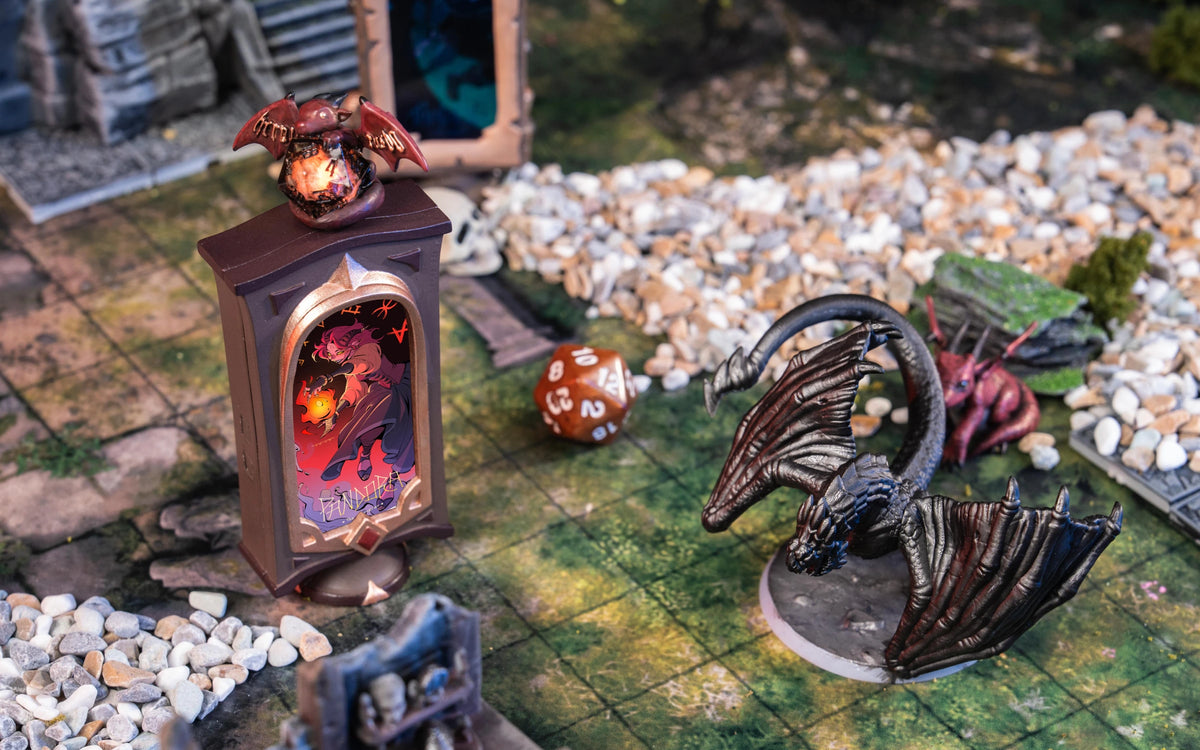 Two Artifact Mini devices on a fantasy game board